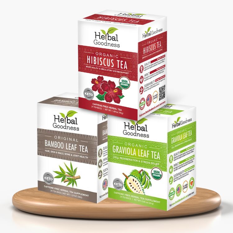 Three boxes of herbal tea trio with hibiscus bamboo leaf and graviola displayed on wooden tray for organic leaf tea